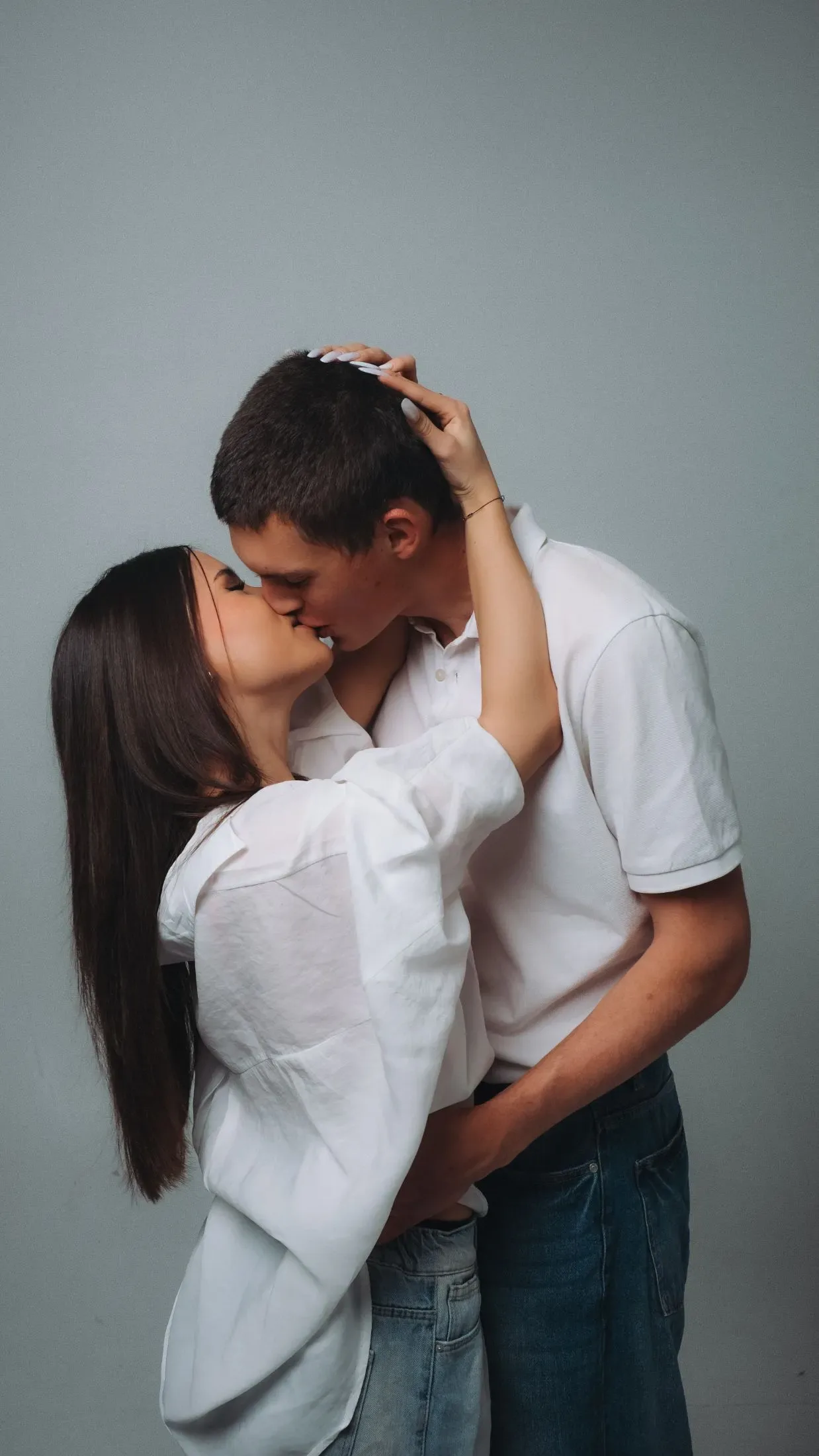 Couple photographed together in a relaxed studio portrait